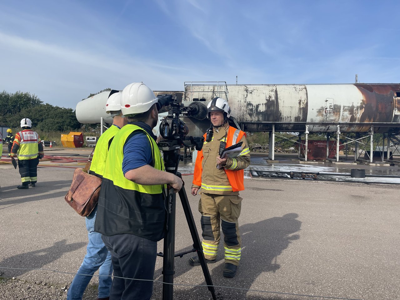 Fire fighter being interviewed by camera crew